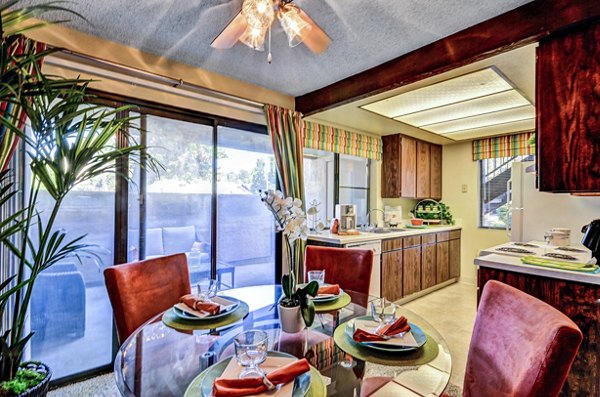 Dining room with modern decor and stylish furniture at The Casas Apartments, a Greystar luxury property in a prime location