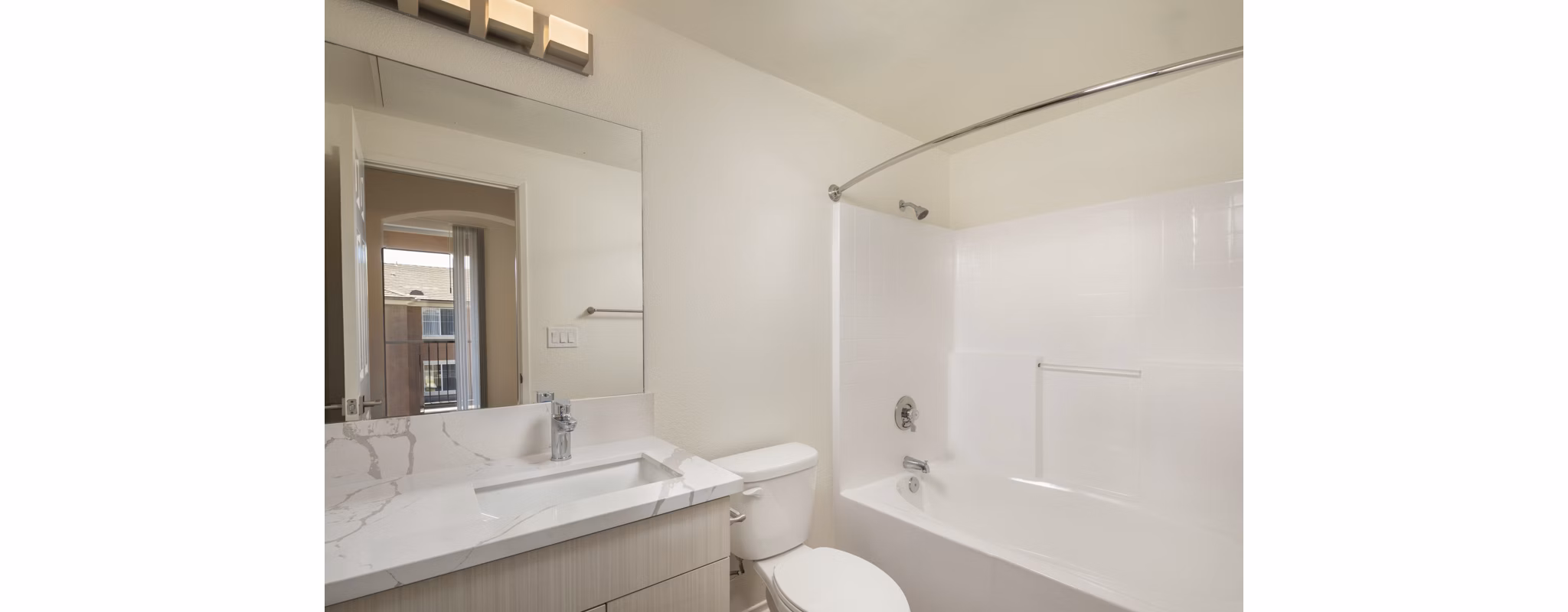 Modern bathroom with sleek fixtures at Casoleil Apartments featuring luxury finishes and contemporary design