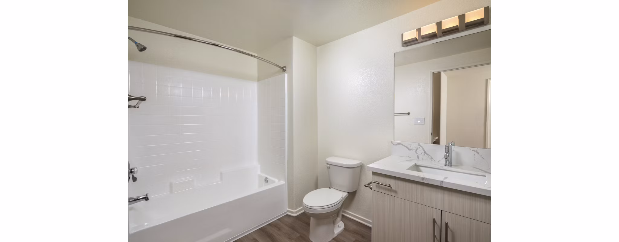 Bathroom featuring modern fixtures and sleek countertops at Casoleil Apartments