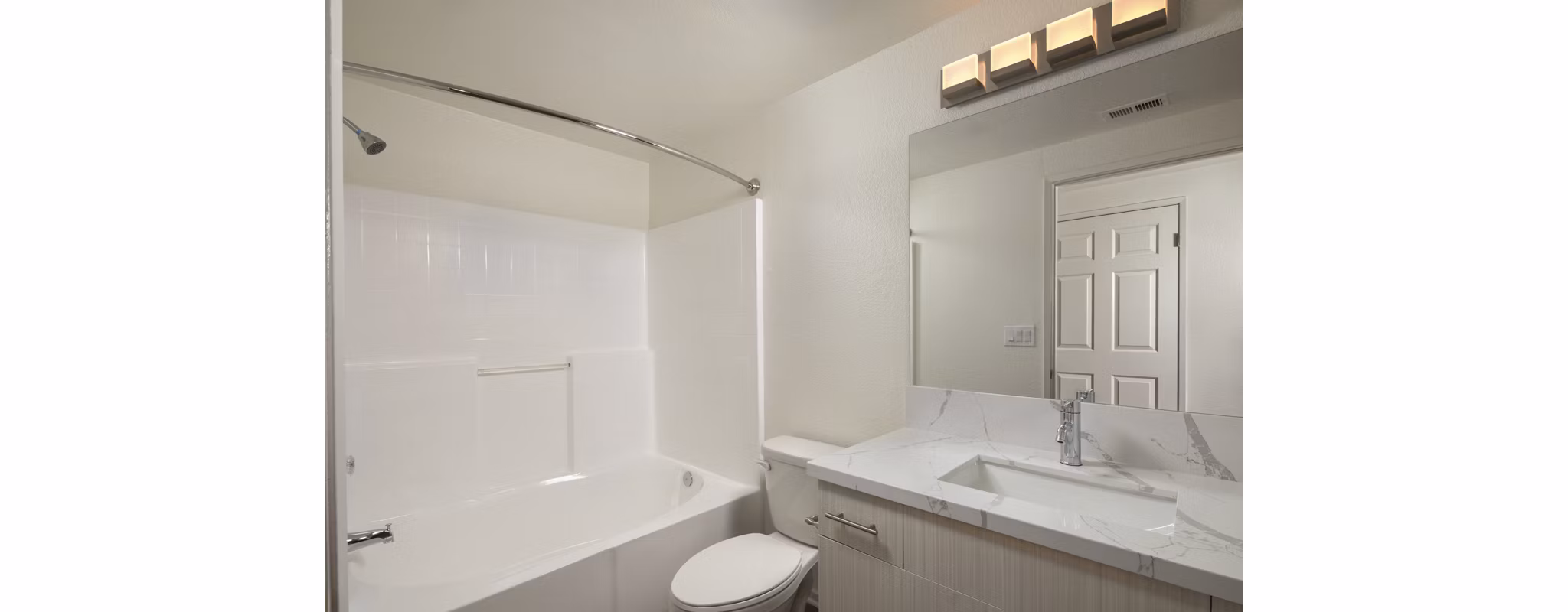 Modern bathroom with sleek fixtures and marble countertops at Casoleil Apartments, a luxury Greystar community