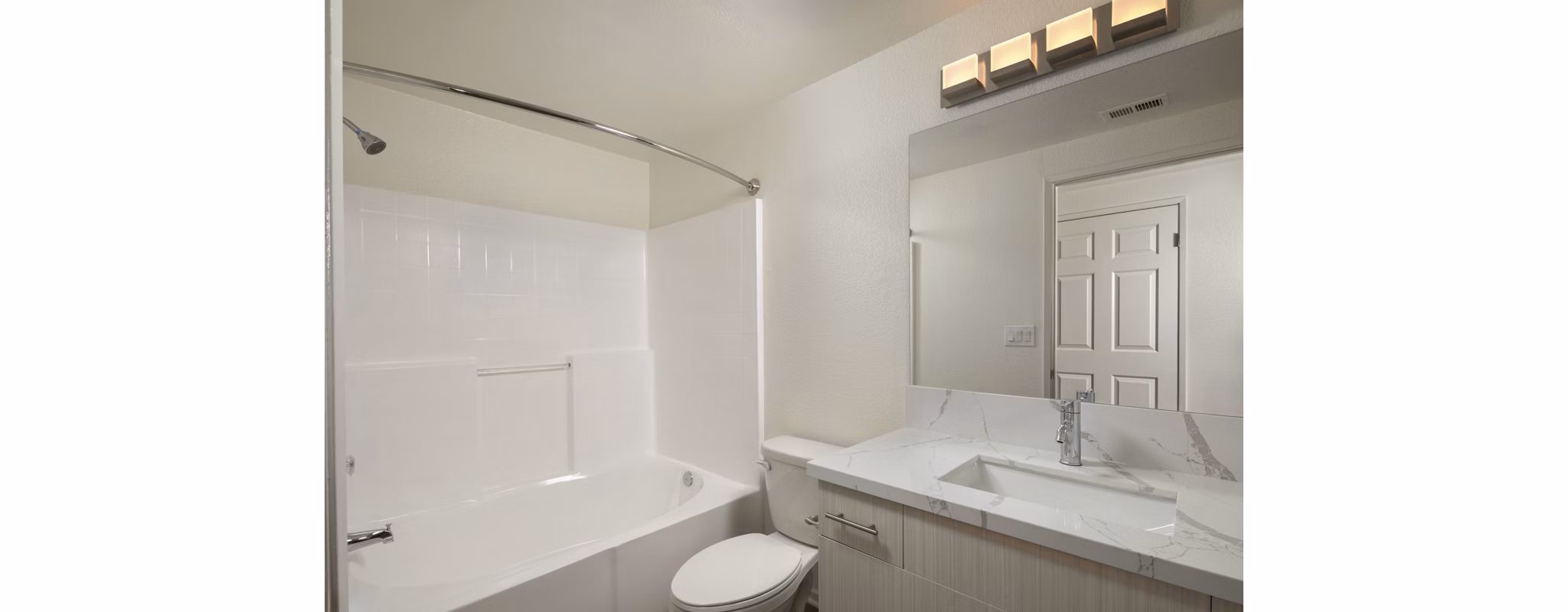 Modern bathroom with sleek fixtures and marble countertops at Casoleil Apartments, a luxury Greystar community