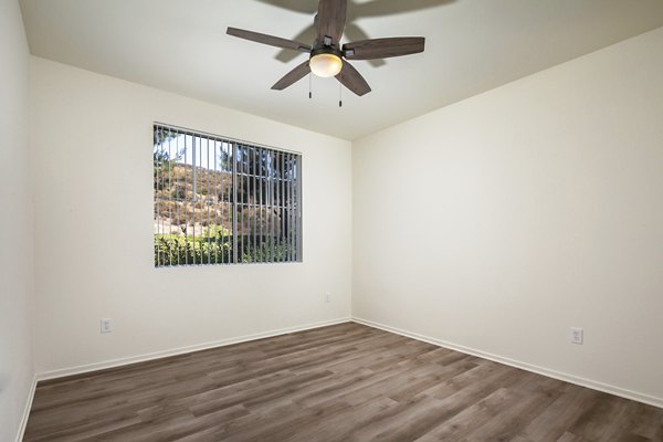Clubhouse featuring modern design and seating at Casoleil Apartments, luxury living by Greystar