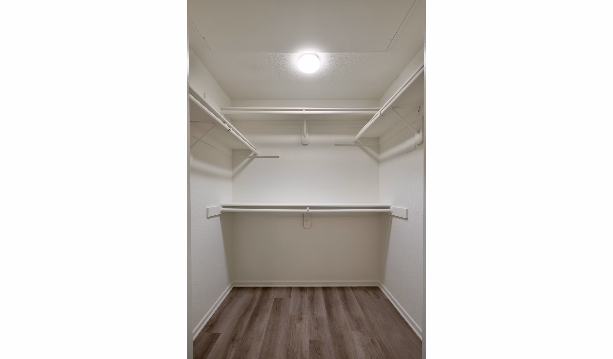 Clubhouse with modern decor and seating areas at Casoleil Apartments, a luxury community by Greystar