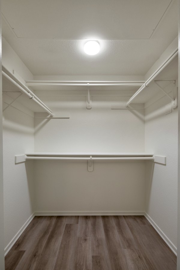 Clubhouse with modern decor and seating areas at Casoleil Apartments, a luxury community by Greystar