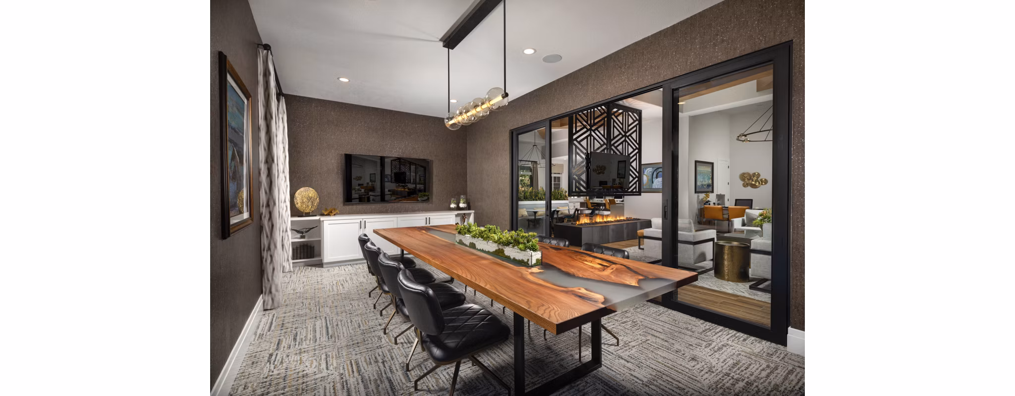 Elegant modern clubhouse featuring spacious seating and architectural design at Casoleil Apartments