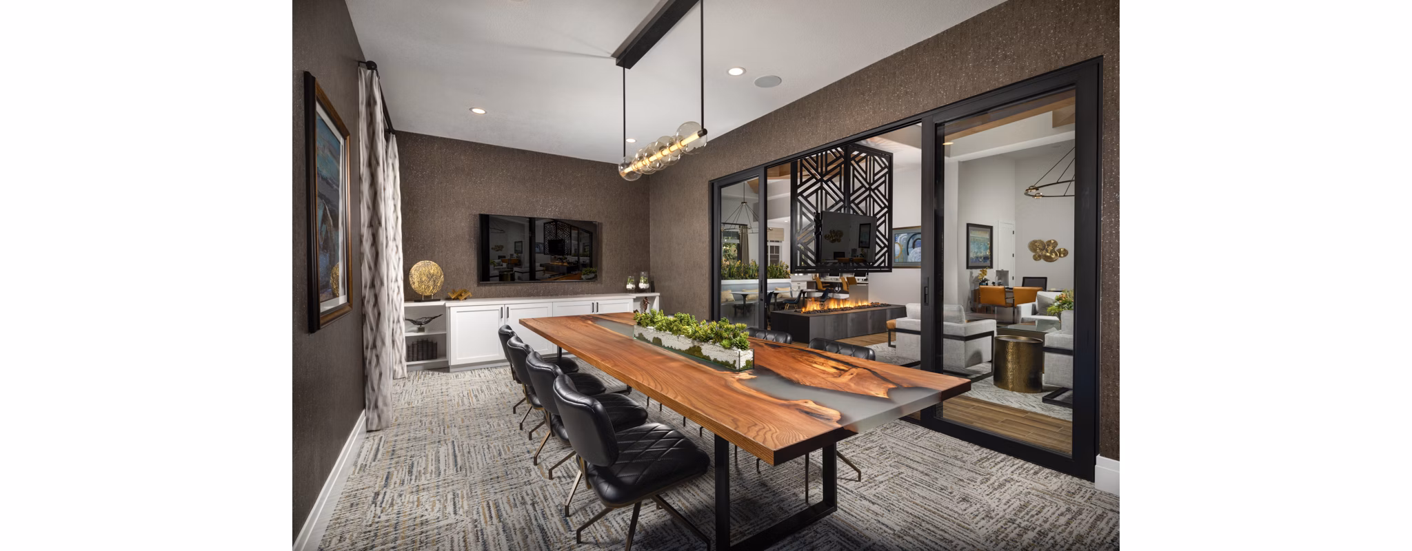 Elegant modern clubhouse featuring spacious seating and architectural design at Casoleil Apartments