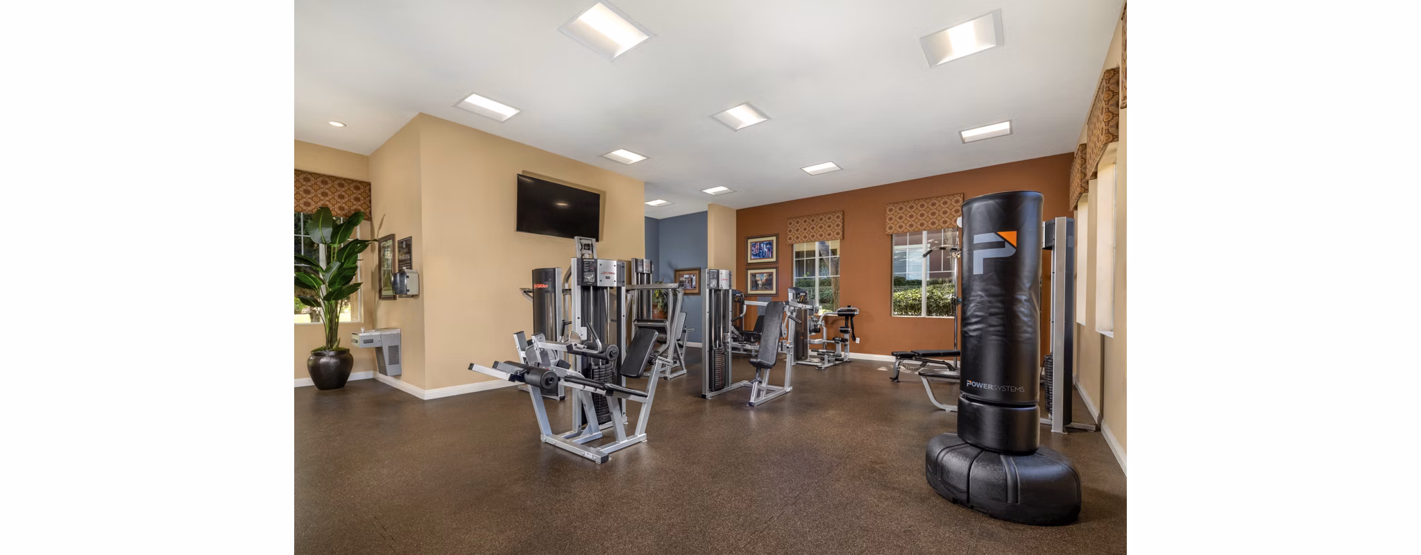 Fitness center with state-of-the-art equipment at Casoleil Apartments in sunny location, offering residents modern exercise facilities