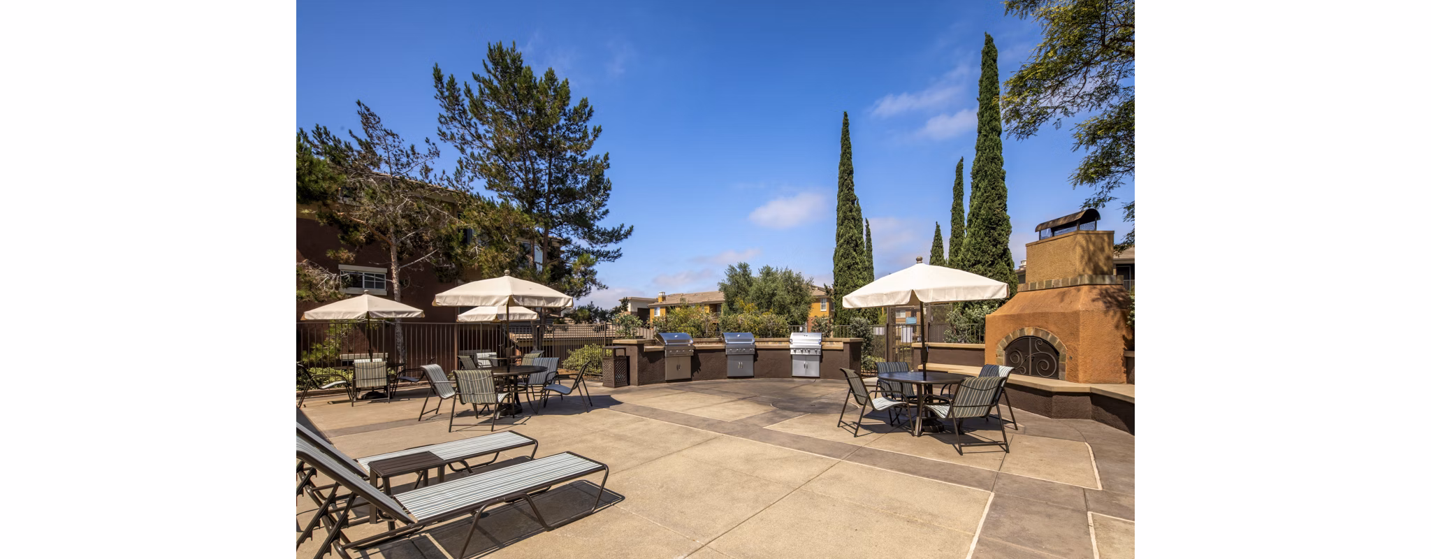 Resort-style pool with lounge chairs at Casoleil Apartments