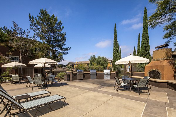 Resort-style pool with lounge chairs at Casoleil Apartments