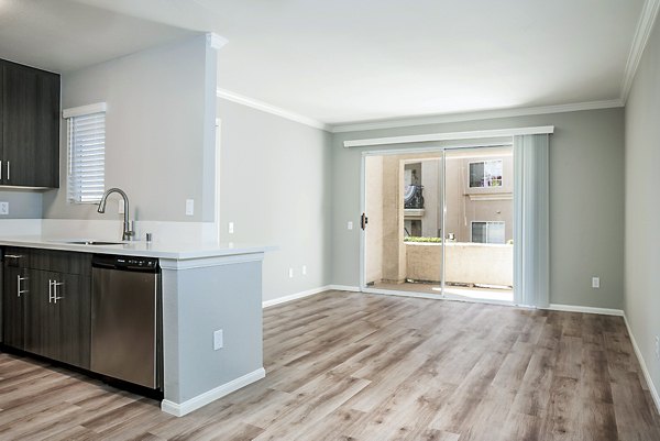 Spacious living room with modern decor in Central Park Apartments