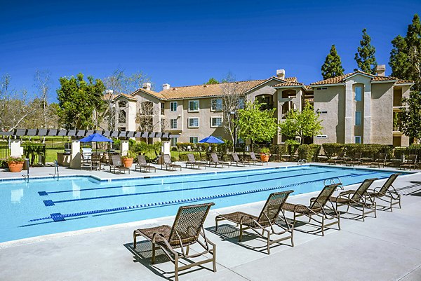 Luxurious poolside lounging area at Central Park Apartments, a Greystar luxury community