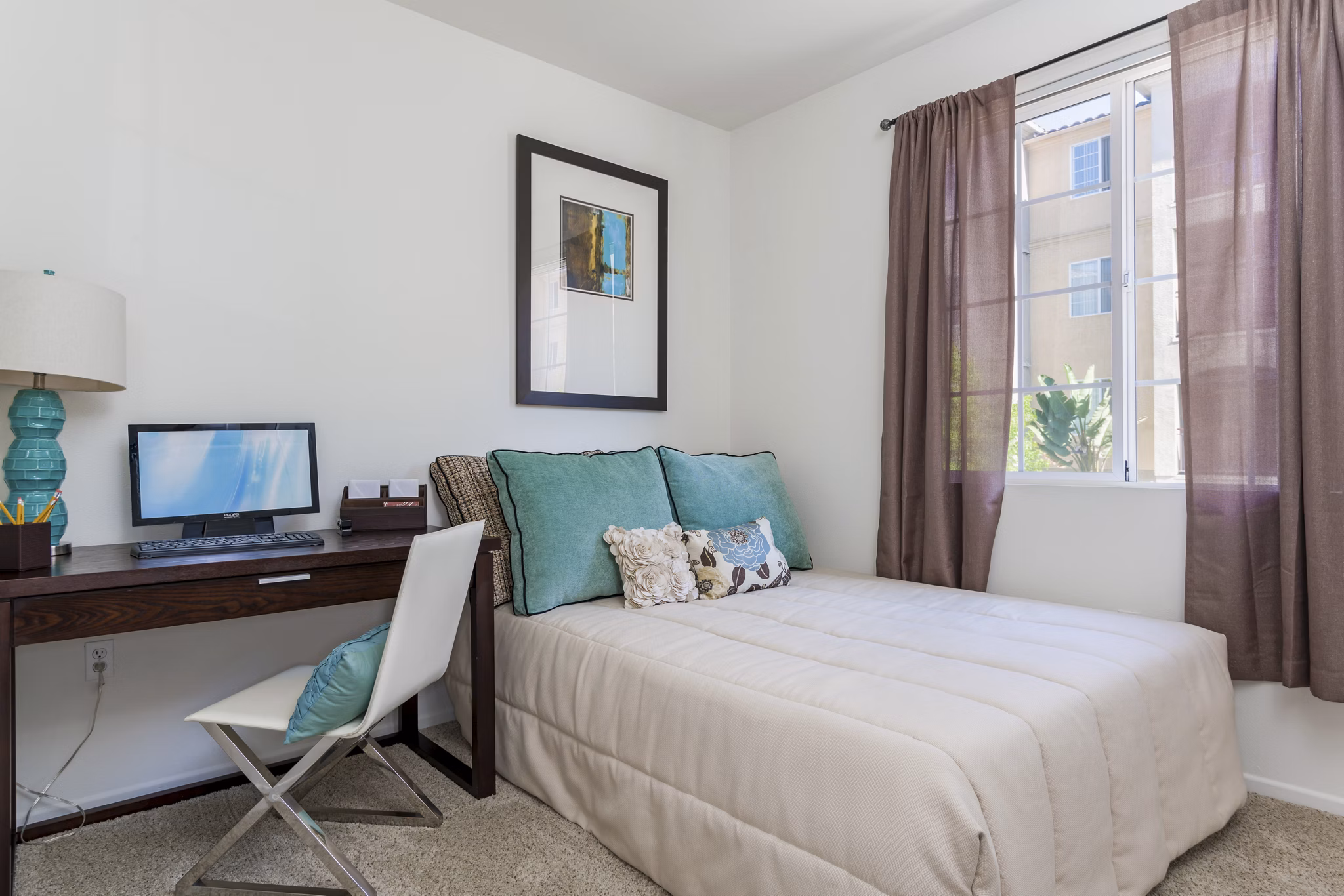 Cozy bedroom with modern decor at Greenfield Village Apartments