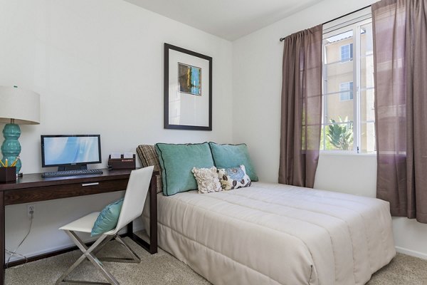 Cozy bedroom with modern decor at Greenfield Village Apartments