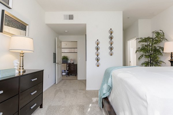 Cozy bedroom with natural light and modern decor at Greenfield Village Apartments