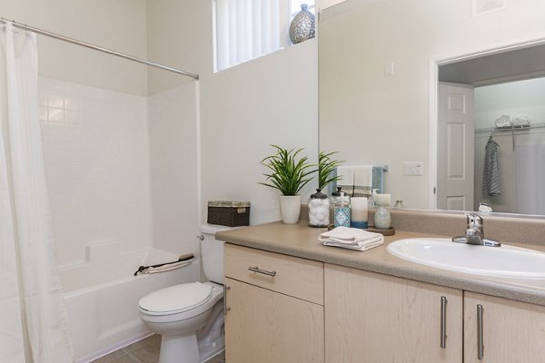 Modern bathroom with sleek fixtures at Greenfield Village Apartments, offering luxury living by Greystar