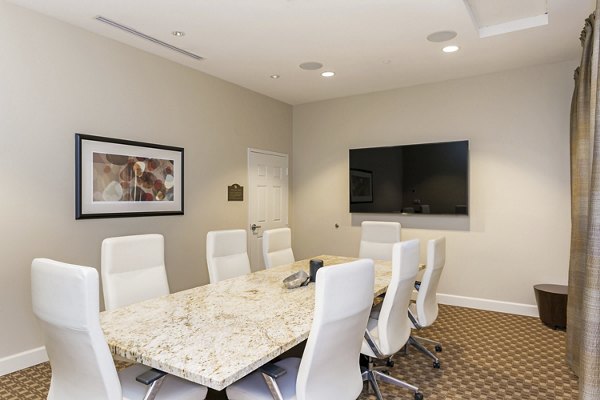 Meeting room featuring modern furniture and audiovisual equipment at Greenfield Village Apartments