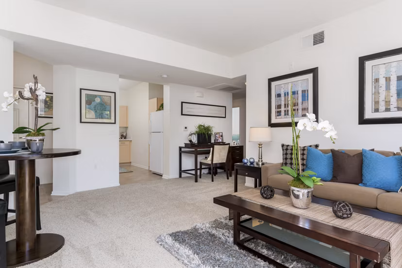 Inviting living room featuring modern furnishings and natural light at Greenfield Village Apartments, luxury Greystar community