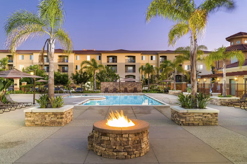 Cozy outdoor fire pit at Greenfield Village Apartments, perfect for social gatherings and relaxation in a luxurious setting