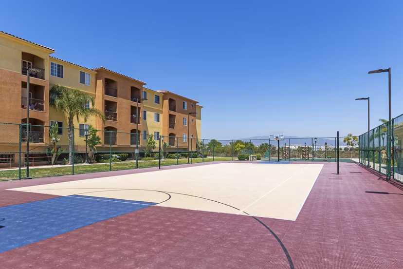 Sport court offering basketball and tennis at Greenfield Village Apartments, a luxury community by Greystar