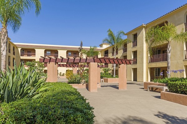 Courtyard with lush landscaping at Greenfield Village Apartments