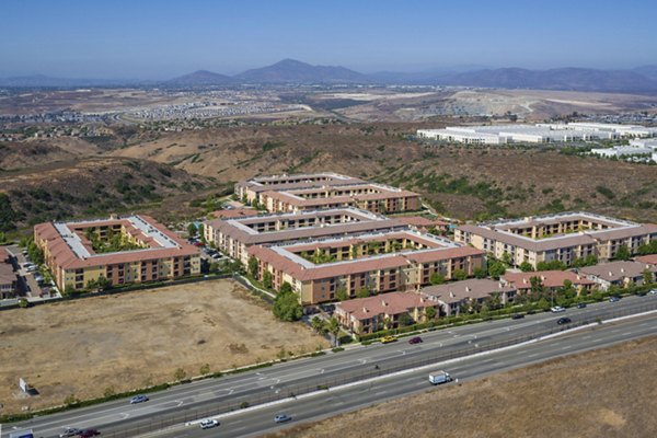 Greenfield Village Apartments: Scenic view of luxury apartments in a lush landscape