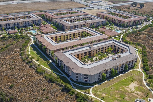Greenfield Village Apartments: Courtyard view of luxury apartments in serene neighborhood setting