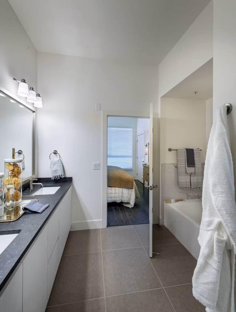 Modern bathroom with sleek fixtures and marble countertops at Hanover West LA Apartments