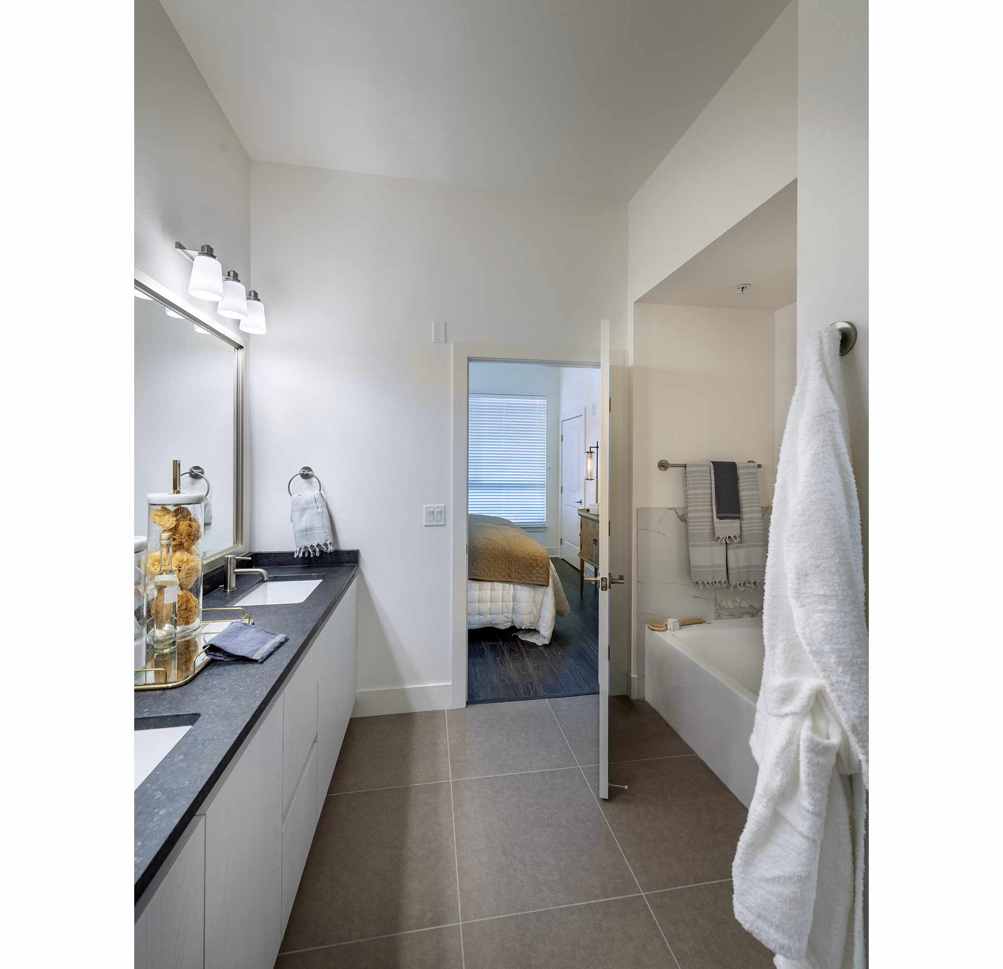 Modern bathroom with sleek fixtures and marble countertops at Hanover West LA Apartments