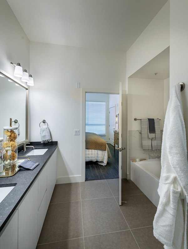 Modern bathroom with sleek fixtures and marble countertops at Hanover West LA Apartments