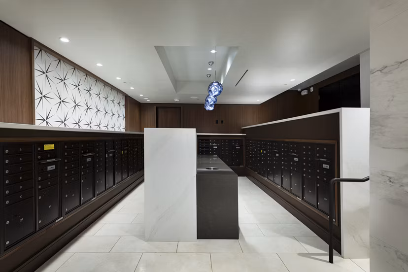 Mail room with locker system at Hanover West LA Apartments