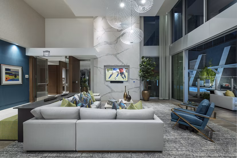 Elegant clubhouse with cozy seating and modern decor at Hanover West LA Apartments, a premier Greystar luxury living community