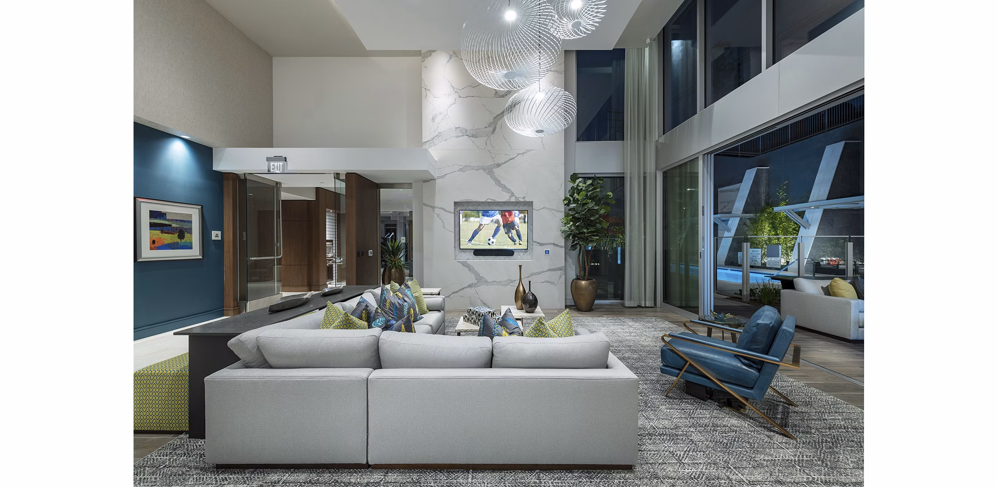 Elegant clubhouse with cozy seating and modern decor at Hanover West LA Apartments, a premier Greystar luxury living community