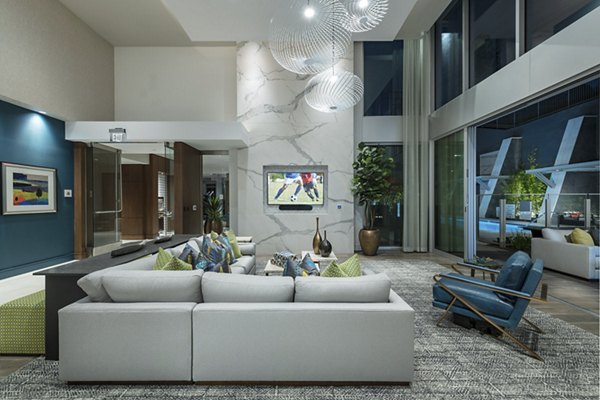 Elegant clubhouse with cozy seating and modern decor at Hanover West LA Apartments, a premier Greystar luxury living community