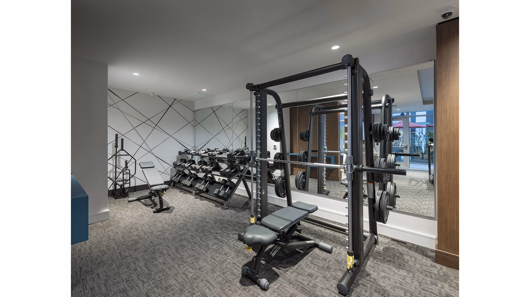 Modern fitness center with state-of-the-art equipment at Hanover West LA Apartments, catering to active lifestyles in a luxury setting