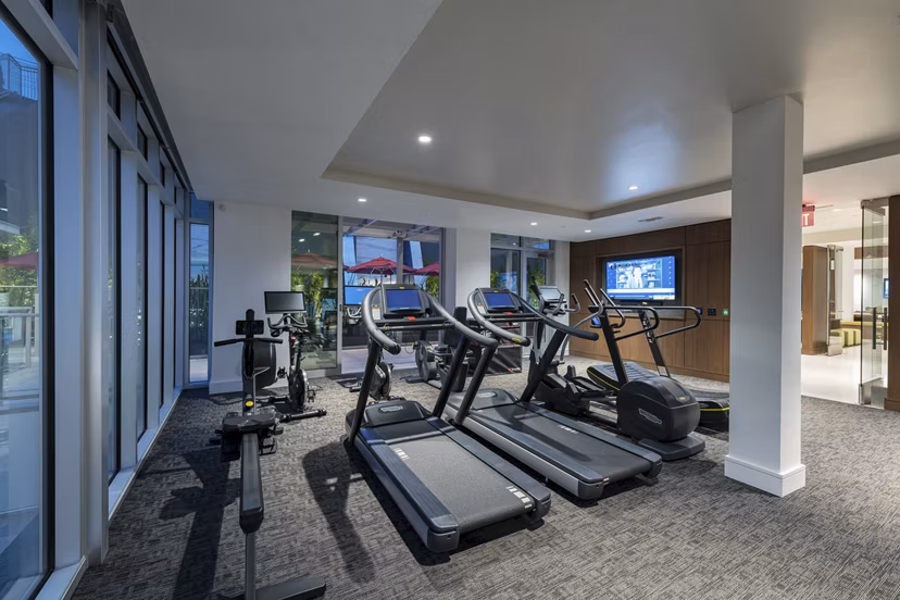 Fitness center with modern equipment at Hanover West LA Apartments
