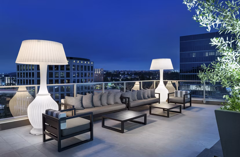 Serene courtyard with lush greenery at Hanover West LA Apartments, luxury living in Los Angeles