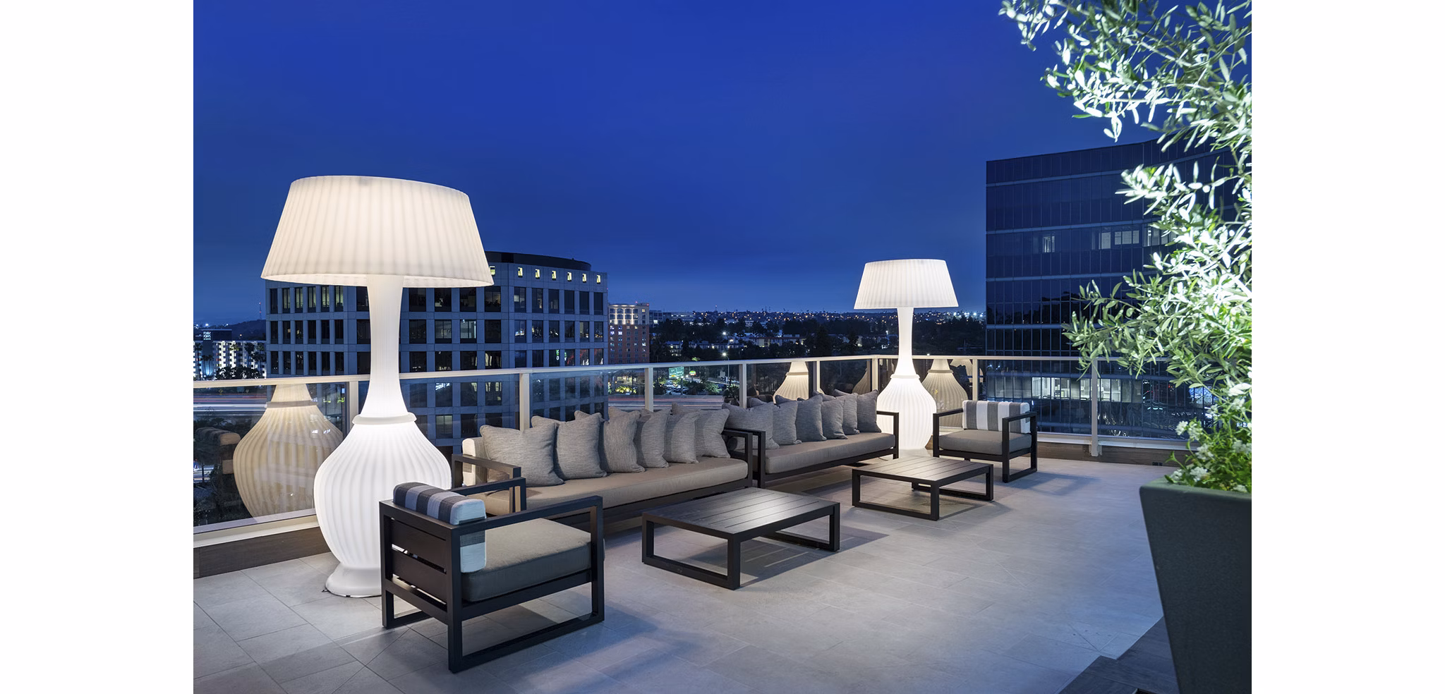 Serene courtyard with lush greenery at Hanover West LA Apartments, luxury living in Los Angeles