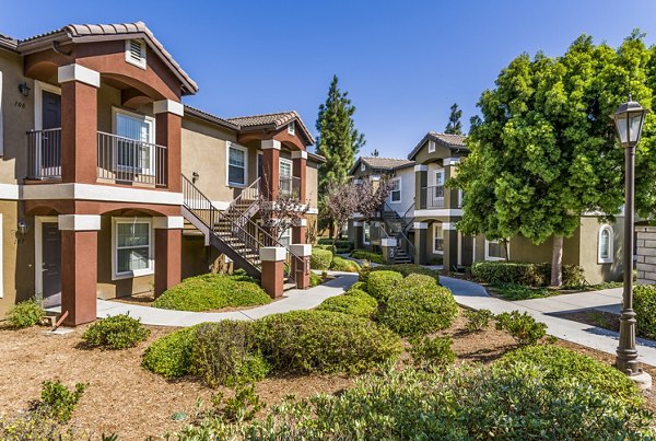 The Landing at Ocean View Hills: Modern apartment building with lush landscaping