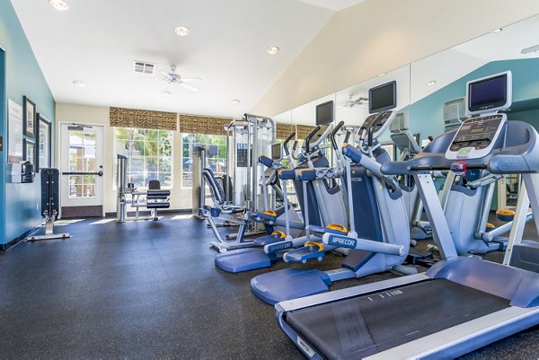 Modern fitness center with state-of-the-art equipment at The Landing at Ocean View Hills Apartments, perfect for active lifestyles and wellbeing