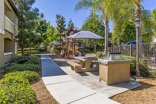 grill area/playground at The Landing at Ocean View Hills Apartments