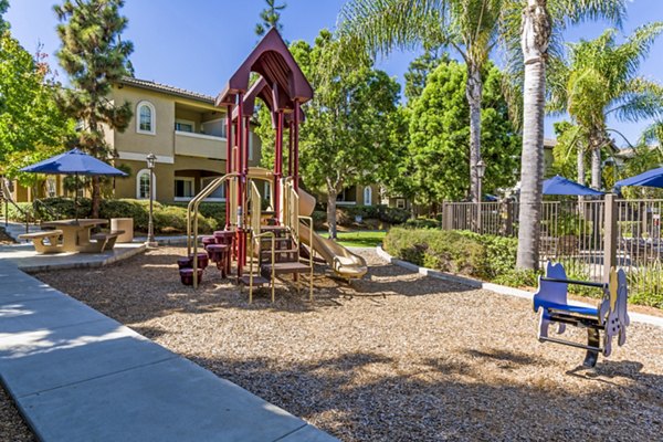 Children's playground at The Landing at Ocean View Hills Apartments, offering family-friendly fun and recreation in a vibrant community setting