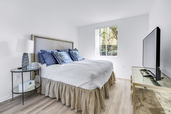 Cozy bedroom with modern decor at Legacy Apartments, offering a luxurious living experience with spacious layout and stylish furnishings