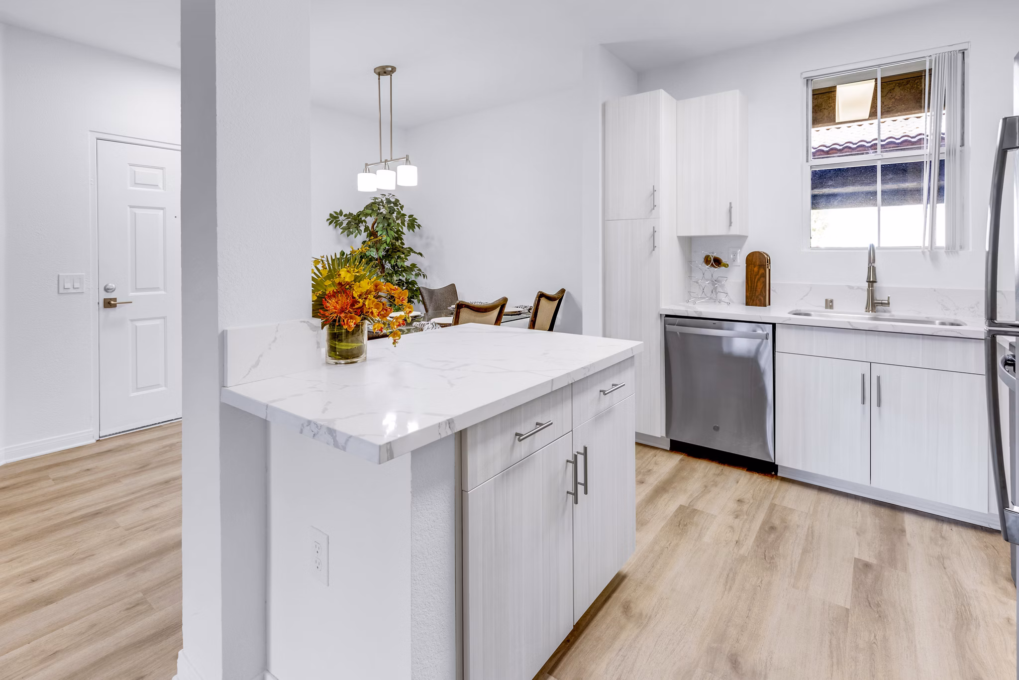 Modern kitchen featuring stainless steel appliances and granite countertops in Legacy Apartments