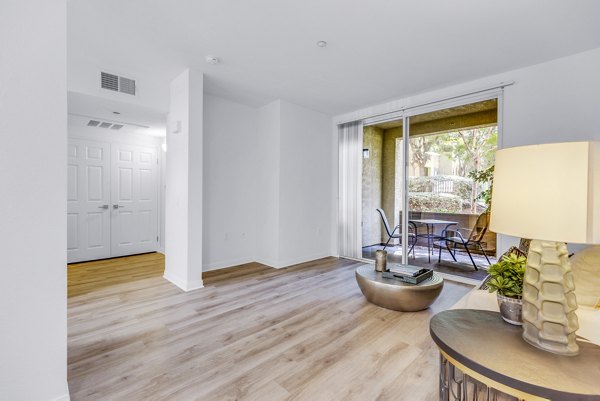 Cozy living room with modern design elements in Legacy Apartments
