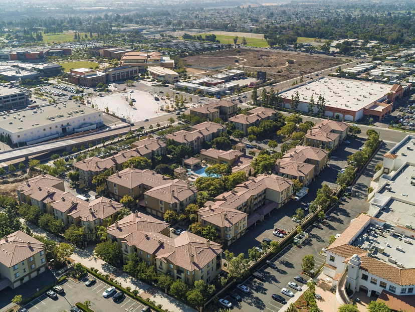 Scenic view from the luxury balcony at Legacy Apartments with city skyline in the background