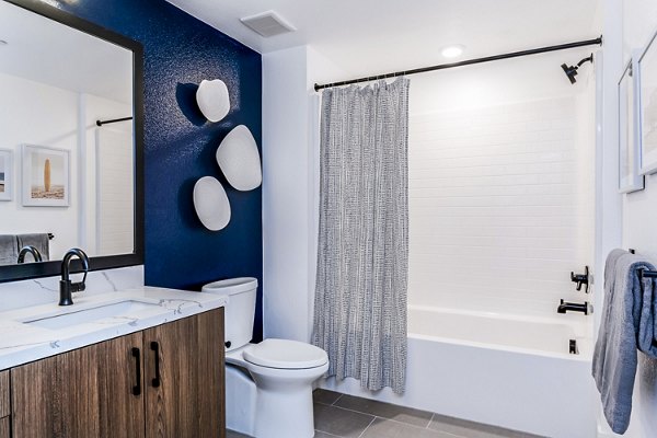 Bathroom with modern fixtures at The Lofts at Carlsbad Village Apartments