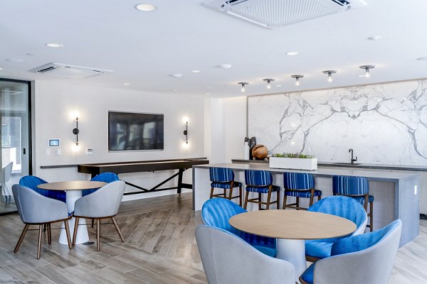 Modern clubhouse with stylish seating at The Lofts at Carlsbad Village Apartments