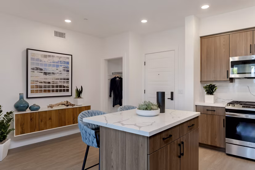 Dining room featuring modern decor and ample natural light at The Lofts at Carlsbad Village Apartments