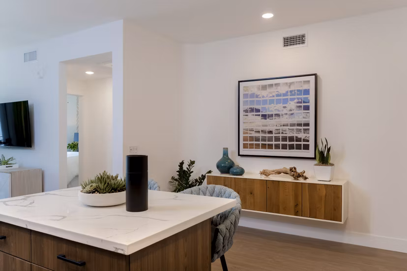 Modern kitchen with stainless steel appliances at The Lofts at Carlsbad Village Apartments
