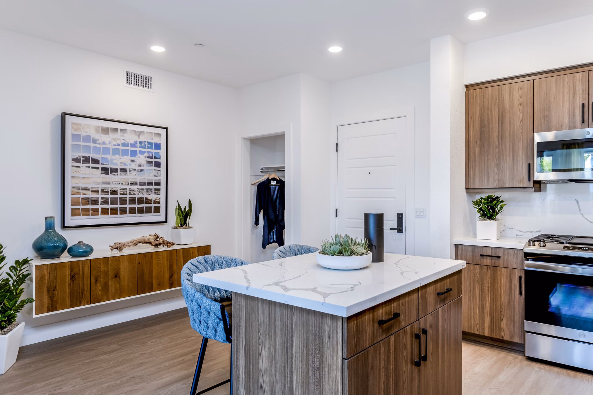 Modern kitchen with stainless steel appliances at The Lofts at Carlsbad Village Apartments